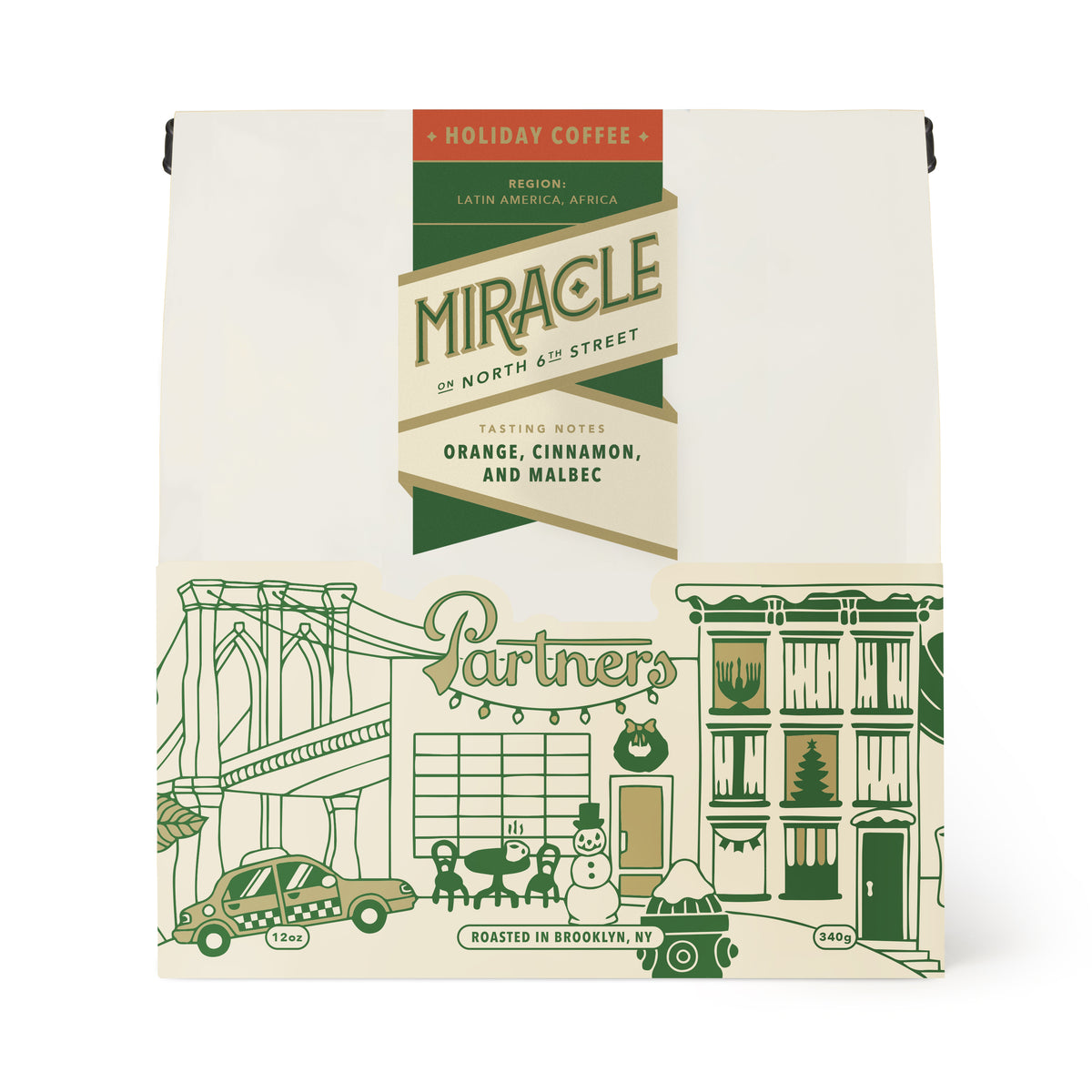 Front view of 12oz Miracle On North 6th St coffee bag showing holiday label with tasting notes of orange, cinnamon, and Malbec