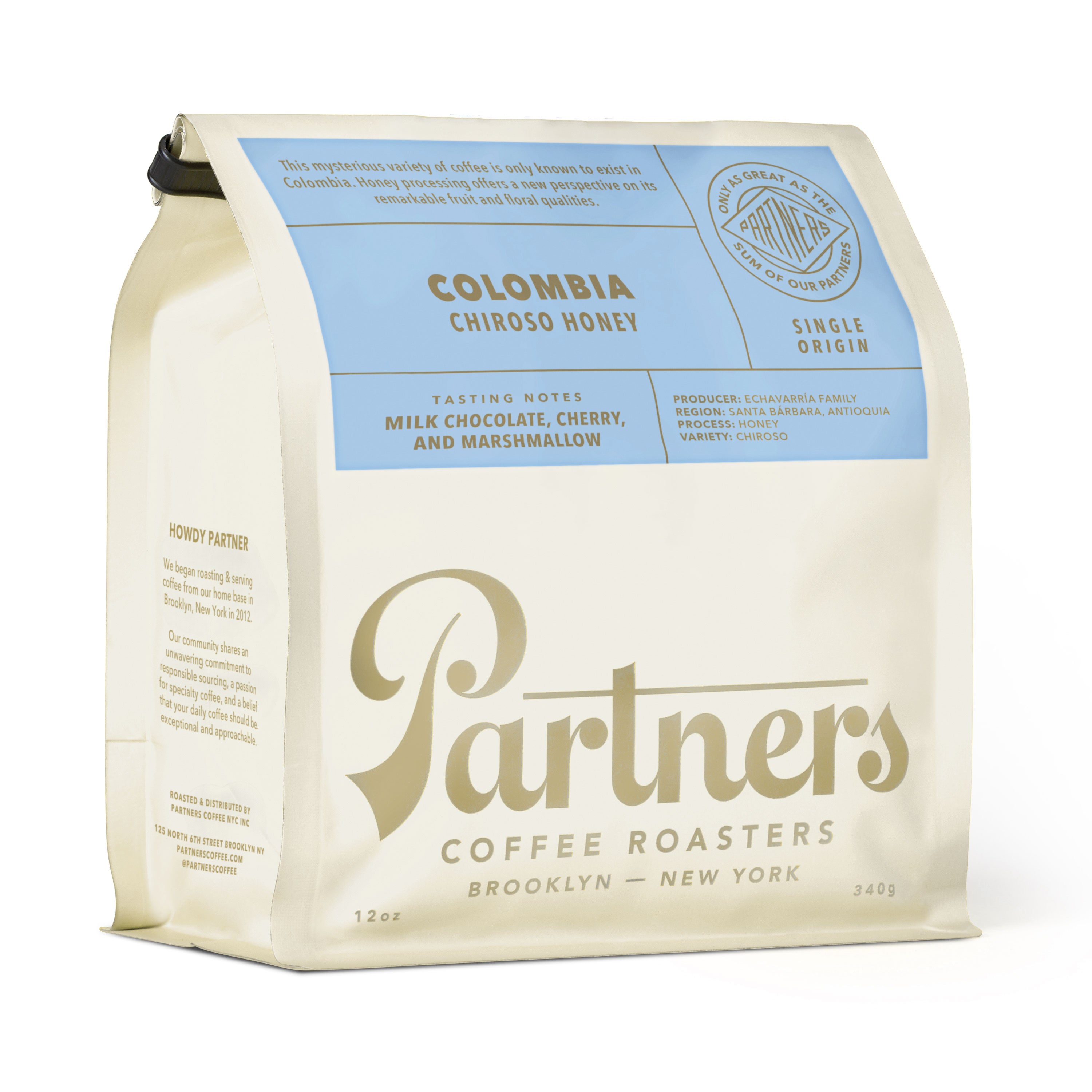 Angled view of Colombia Chiroso Honey coffee bag showcasing cream packaging and blue label on a white background
