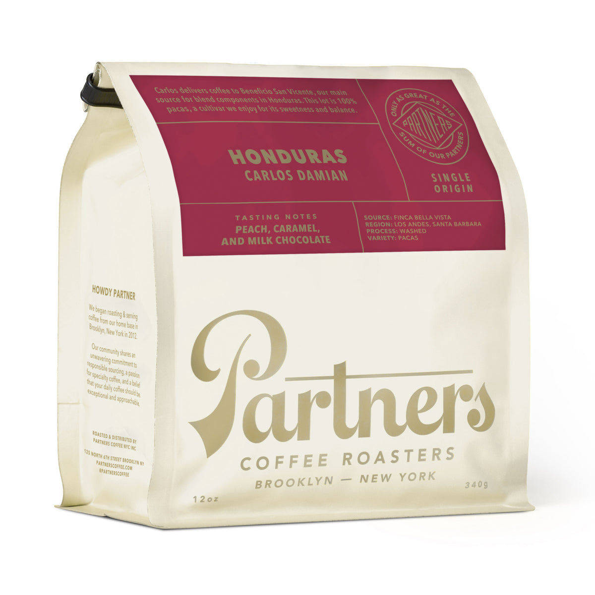 Angled view of a 12 oz Honduras Carlos Damian coffee bag showcasing peach, caramel, and milk chocolate notes
