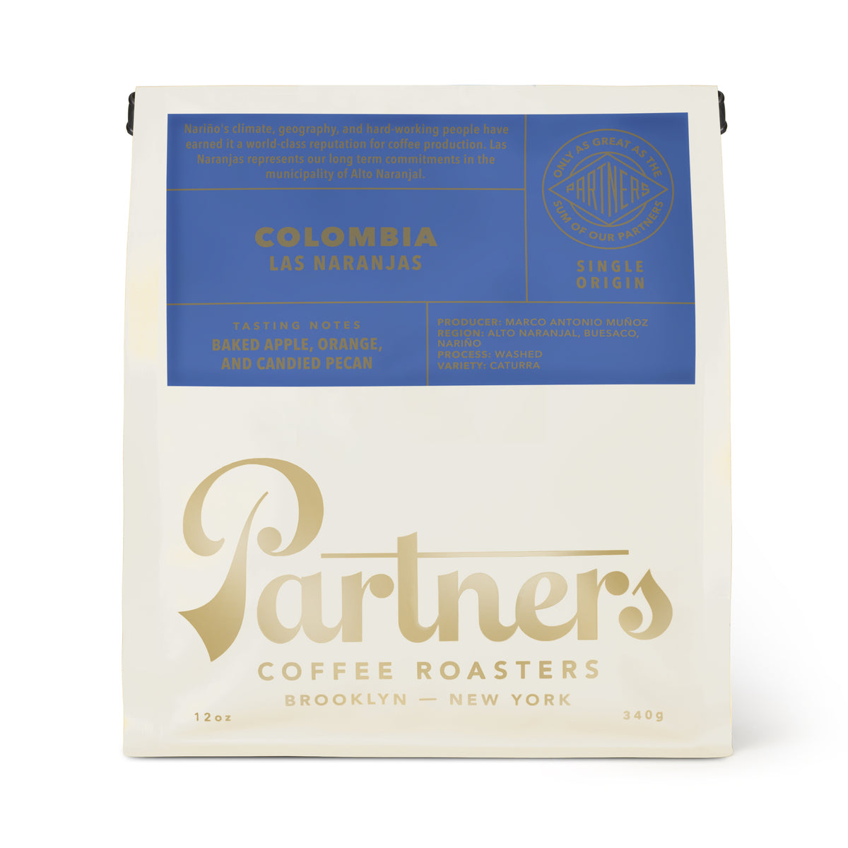 Front view of Colombia Las Naranjas coffee bag with blue label and baked apple, orange, and candied pecan notes