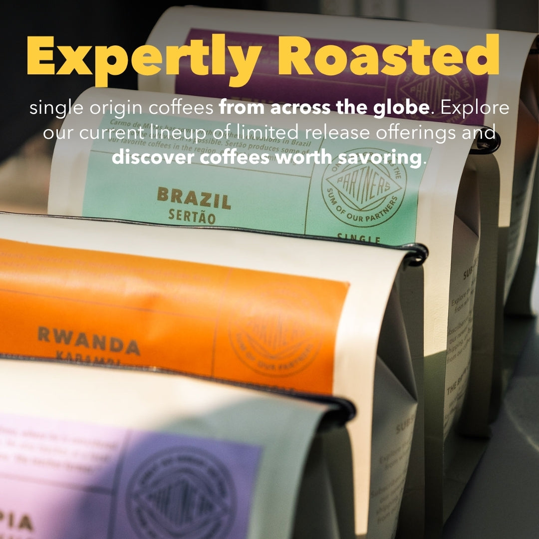 Close-up of Single Origin Shuffle subscription showcasing expertly roasted single origin coffee bags on a coffee roaster
